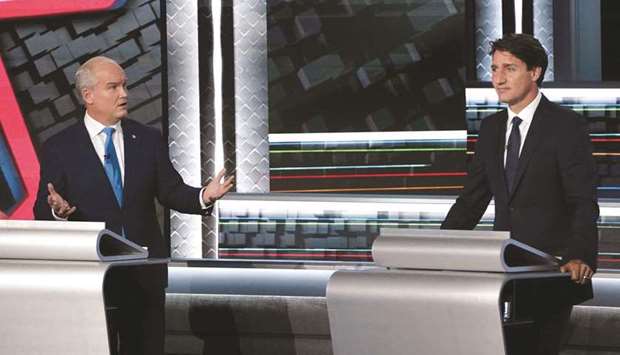 Ou2019Toole (left) turns to Prime Minister Trudeau during the federal election French-language leadersu2019 debate at the Canadian  Museum of History in Gatineau, Quebec, on Wednesday night.