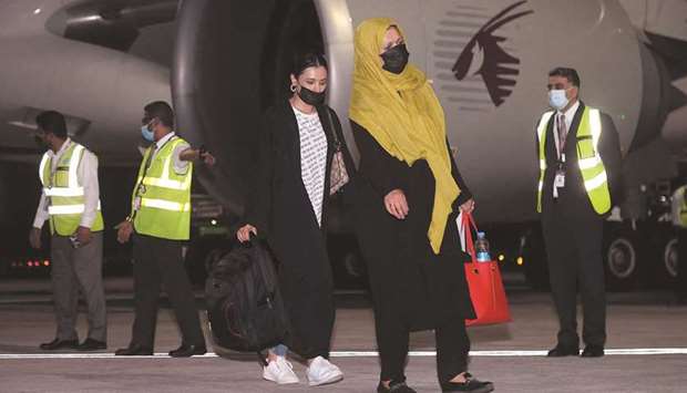 Passengers after arriving at Dohau2019s Hamad International Airport from Kabul yesterday.