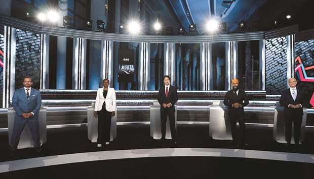 From left: Bloc Quebecois leader Yves-Francois Blanchet, Green Party leader Annamie Paul, Liberal leader and Prime Minister Justin Trudeau, NDP leader Jagmeet Singh, and Conservative leader Erin Ou2019Toole pose for an official photo before the federal election English-language debate in Gatineau, Quebec.