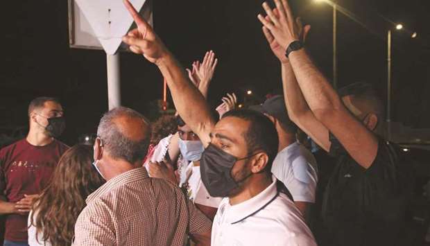 Arab-Israelis chant slogans in support of the recaptured four Palestinians, of the six fighters who escaped from a high-security prison earlier this week, outside the magistratesu2019 court in the city of Nazareth, yesterday.