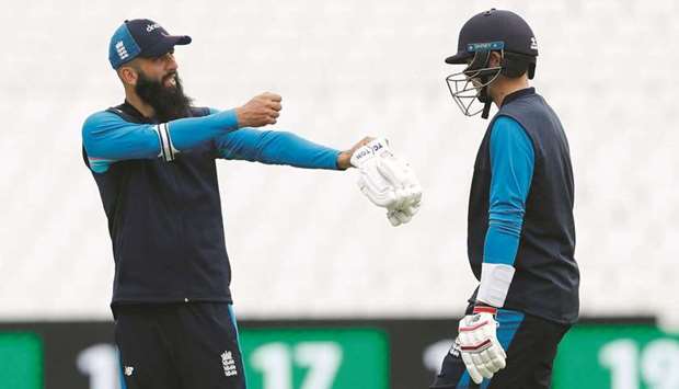 Englandu2019s Moeen Ali with Joe Root during nets yesterday. (Reuters)
