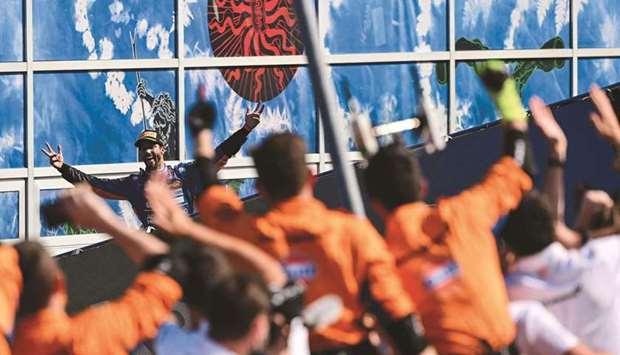 McLarenu2019s Australian driver Daniel Ricciardo celebrates his win in the Italian Grand Prix during the podium ceremony at the Autodromo Nazionale circuit in Monza, Italy, yesterday. (AFP)?