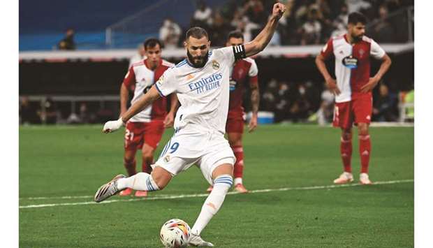 Real Madridu2019s Karim Benzema coverts a penalty kick during the La Liga match against Celta Vigo in Madrid on Sunday. (AFP)