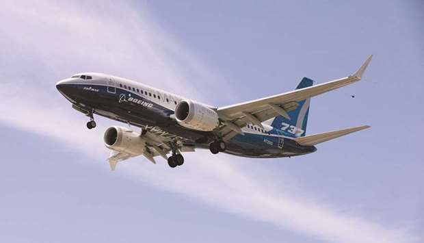 A Boeing 737 MAX lands after a test flight at Boeing Field in Seattle, Washington (file). The planemaker, which dominates jet sales together with Europeu2019s Airbus, forecast 43,610 commercial jet deliveries over the next 20 years worth $7.2tn, an increase of 500 units from the 43,110 projected a year ago.