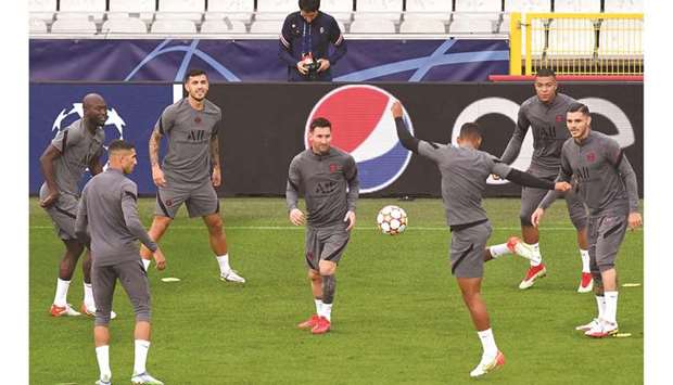 Paris Saint-Germainu2019s Lionel Messi (centre) takes part in a training session with teammates at the Jan Breydel Stadium in Bruges, Belgium, yesterday. (AFP)
