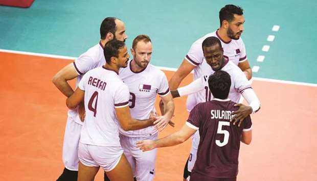 Qatar players celebrate a point during their match against Bahrain at the Asian Volleyball Championship in Chiba, Japan, yesterday.
