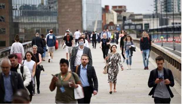 (File Photo) People walk across London Bridge during morning rush hour, in London, Britain, recently. (REUTERS)
