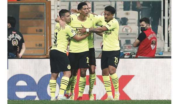 Borussia Dortmundu2019s Jude Bellingham celebrates his goal with teammates during the UEFA Champions League match against Besiktas in Istanbul, Turkey, yesterday. (Reuters)