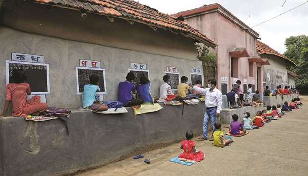 Deep Narayan Nayak teaches children in an open air class at Joba Attpara village in Paschim Bardhaman district in West Bengal.