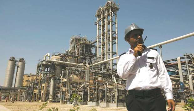 A security person stands in front of the Mahshahr petrochemical plant in Khuzestan province, some 1032km southwest of Tehran (file). Iran exported petrochemicals and petroleum products worth almost $20bn in 2020, twice the value of its crude exports, oil ministry and central bank figures show.