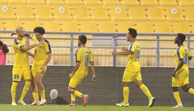 Al Gharafau2019s Sofiane Hanni (left) celebrates with teammates after scoring against Al Ahli during the QNB Stars League.