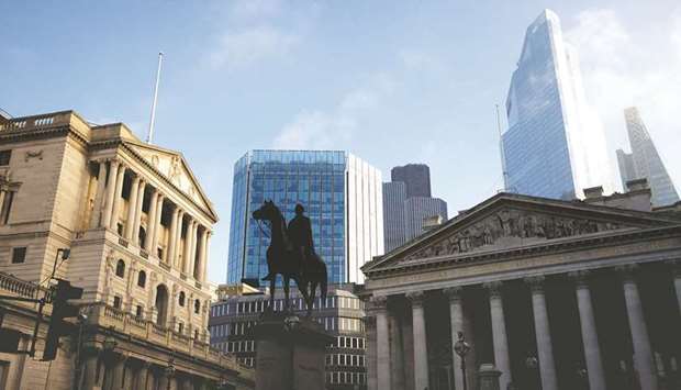 The Bank of England and the City of London financial district in London (file). Both the pound and FTSE 100 Index have trailed market benchmarks since June, and derivatives show that bearishness is now seeping through investor consciousness.