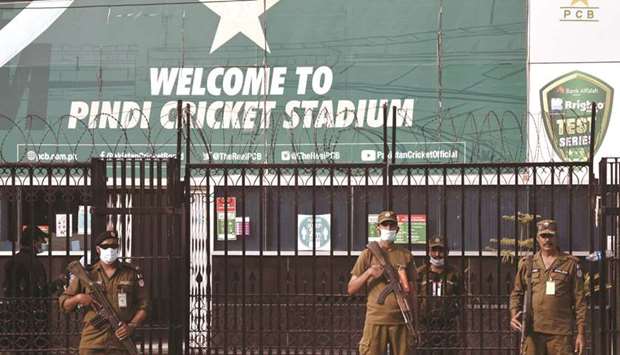 Police officers stand guard outside Rawalpindi Cricket Stadium after New Zealand cricket team pull out of a Pakistan tour over security concerns in Rawalpindi on Friday. (Reuters)