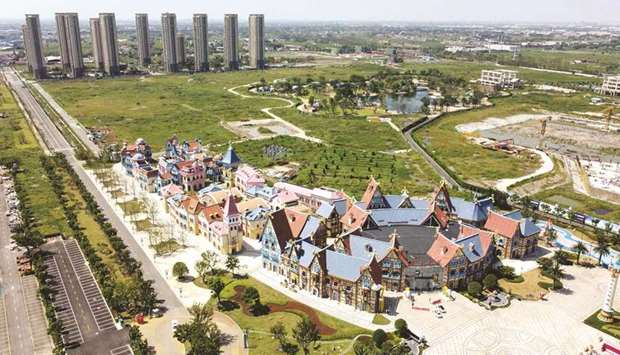 This aerial photo taken on September 17 shows the halted under-construction Evergrande Cultural Tourism City, a mixed-used residential and retail-entertainment development, in Taicang, Suzhou city, in Chinau2019s eastern Jiangsu province. Concern over Evergrandeu2019s ability to make good on $300bn of liabilities is spilling into Chinau2019s financial markets.