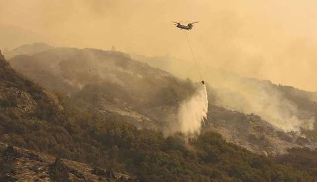 A firefighting helicopter carries water to drop on the fire as smoke rises in the foothills along Generals Highway during a media tour of the KNP Complex fire in the Sequoia National Park near Three Rivers, California (file). Economics done right, meanwhile, points to significantly more climate action than is currently happening. None of this, of course, lets economists off the hook from examining their own biases.