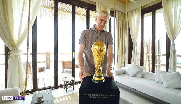 Arsene Wenger with FIFA World Cup trophy