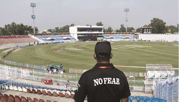 A member of the Police Elite Force stands guard at the Rawalpindi Cricket Stadium, after the New Zealand cricket team pulled out of a Pakistan cricket tour over security concerns, in Rawalpindi, on Friday. (Reuters)
