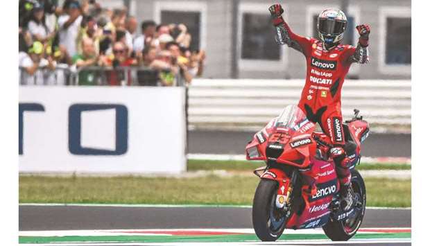 Ducatiu2019s Italian rider Francesco Bagnaia celebrates after winning the San Marino MotoGP Grand Prix in Misano Adriatico, Italy, yesterday. (AFP)