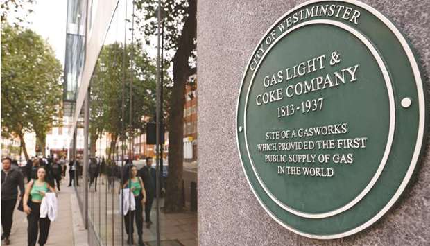 A plaque commemorating the site of the first public gasworks in the world is seen in Westminster, London yesterday. Benchmark wholesale British gas prices have more than trebled this year to record highs due to several factors including low stock levels, strong demand in Asia making it tougher to attract LNG cargoes and maintenance issues at key infrastructure.