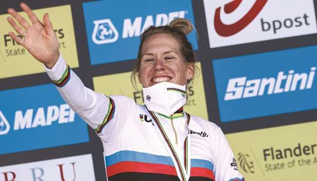 Netherlandsu2019 cyclist Ellen van Dijk celebrates on the podium after winning the time trial race of the UCI World Championships in Bruges yesterday. (AFP)
