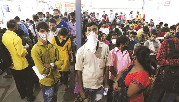 People wait to receive a Covid-19 vaccine in a hospital in Mumbai yesterday.