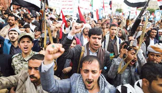 Supporters of Yemenu2019s Houthis shout slogans during a rally to celebrate the seventh anniversary of the ousting of the government in Sanaa, yesterday.
