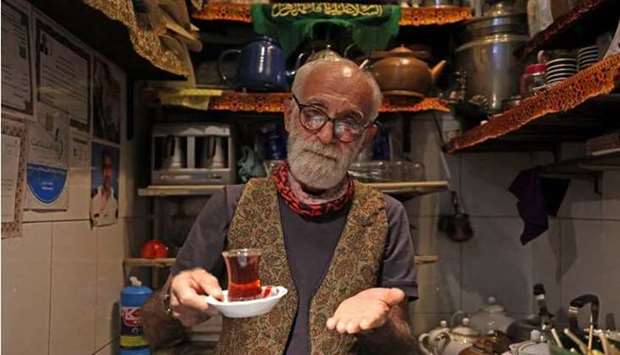 Owner Kazem Mabhutian, 63, serves tea at the smallest and oldest teahouse tucked away in an alleyway of the Grand Bazaar in Tehran.