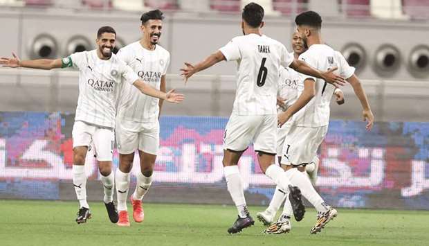 Al Sadd captain Hassan al-Haydos (celebrates) with teammates after scoring against Al Rayyan in the QNB Stars League at the Khalifa International Stadium on Wednesday.