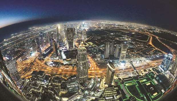 A view of the Dubai city skyline as seen from the Burj Khalifa (file). But while headcounts are swelling with freshly recruited cooks and cabin crew, Dubaiu2019s economy is facing a fraught path to normalcy.