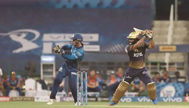 Rahul Tripathi (right) of Kolkata Knight Riders plays a shot during the IPL match against Mumbai Indians at the Sheikh Zayed Stadium in Abu Dhabi yesterday. (Sportzpics for IPL)