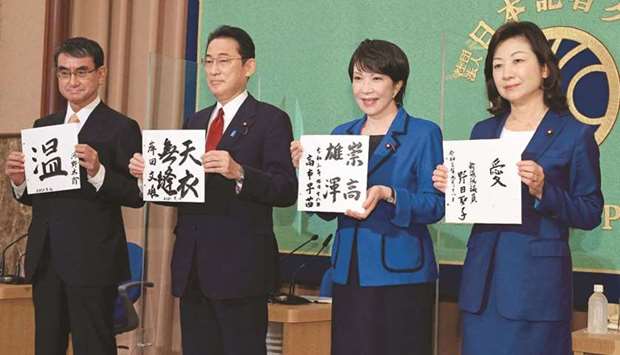 Candidates for the presidential election of the ruling Liberal Democratic Party, Taro Kono, the cabinet minister in charge of vaccinations; Fumio Kishida, former foreign minister; Sanae Takaichi, former internal affairs minister; and Seiko Noda, former internal affairs minister; pose for photographers prior to a debate in Tokyo. (AFP)