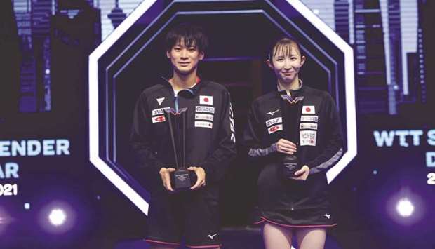 Japanu2019s Shunsuke Togami (left) and Hina Hayata celebrate with the trophy after winning the mixed doubles title at the WTT Star Contender at Lusail Sports Arena on Friday.