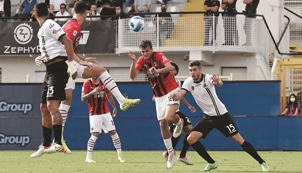 AC Milanu2019s Daniel Maldini (second right) scores against Spezia during the Serie A match yesterday. (Reuters)