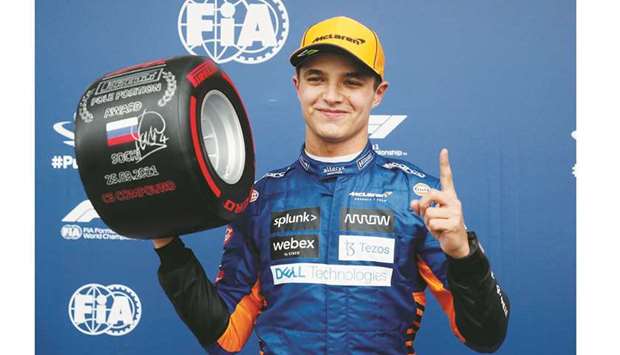 McLarenu2019s Lando Norris celebrates pole position after qualifying at the Russian Grand Prix in Sochi, Russia, yesterday. (Reuters)