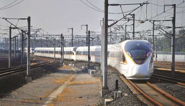 A bullet train, travelling from Beijing to Shanghai, arrives at Jinan West Station in Shandong  Province (file). Chinau2019s crackdown on power consumption is being driven by rising demand for electricity and surging coal and gas prices as well as strict targets from Beijing to cut emissions.