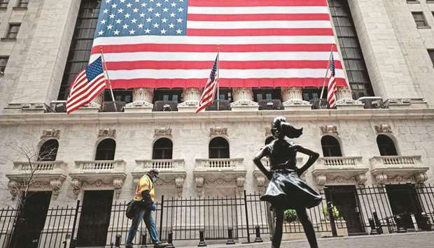 (File photo) A man passes by the New York Stock Exchange building in Manhattan, in New York City, US. (AFP)