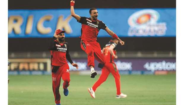 Harshal Patel (centre) of RCB celebrates his hat-trick during the IPL match against the Mumbai Indians at the Dubai International Stadium yesterday. (Sportzpics for IPL)