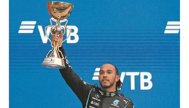 Mercedesu2019 Lewis Hamilton celebrates with the trophy after winning the Russian Grand Prix in Sochi yesterday. (Reuters)
