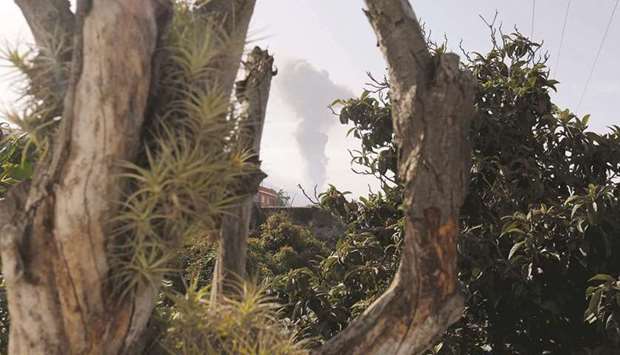 A column of smoke is seen as the Cumbre Vieja volcano resumes activity after a short pause.