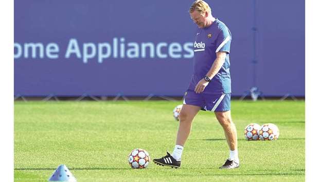 Barcelonau2019s Dutch coach Ronald Koeman during a training session at the Joan Gamper training ground in Sant Joan Despi in Spain yesterday. (AFP)