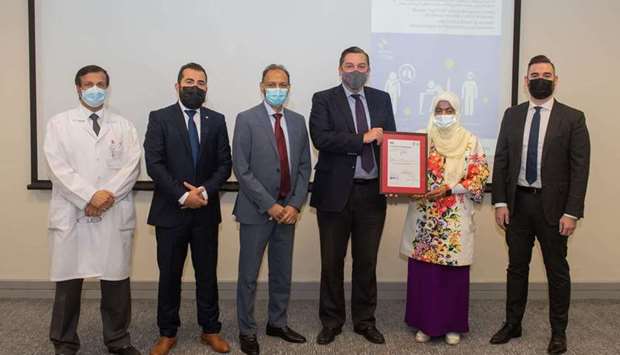 The ISO accreditation certificate was presented by British Ambassador to Qatar, Jon Wilks, to Executive Director of Nursing Informatics Department at HMC, Dr. Wasmiya Dalhem Al Kuwari.