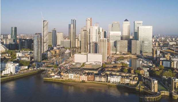 Skyscrapers housing the offices of global financial institutions stand in the Canary Wharf financial, business and shopping district in an aerial view in London. Investors are tracking a number of undervalued UK companies, including household names in gambling, energy and fashion, as some of the worldu2019s lowest equity valuations raise the prospect of a new round of takeover deals in the final months of 2021.