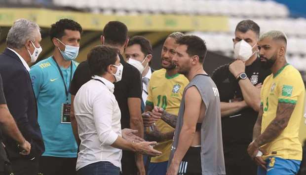 Argentinau2019s Lionel Messi and Brazilu2019s Neymar are seen as their World Cup qualifier in Sao Paulo is interrupted after Brazilian health officials objected to the participation of three Argentine players they say broke quarantine rules. (Reuters)