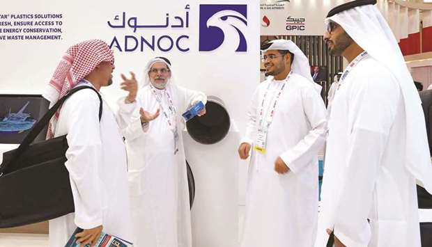 Visitors and guests are seen at Adnoc stand during the 20th Middle East Oil & Gas Show and Conference (MOES 2017) in Manama (file). The company will offer at least 7.5% of Adnoc Drilling, it said on Monday.