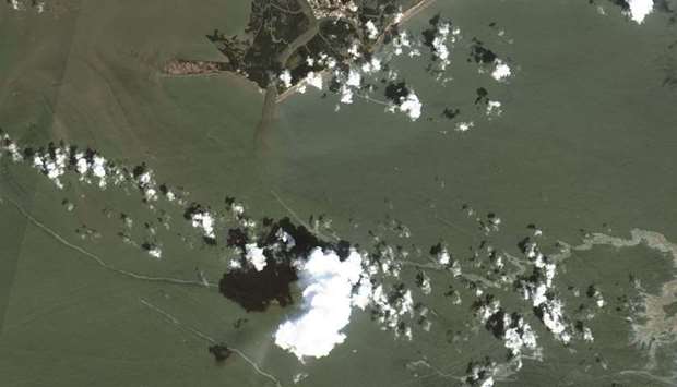 This handout satellite image released by Maxar Technologies shows oil slicks from spills in the Gulf of Mexico, off the coast of Louisiana.