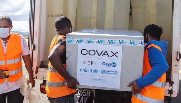 Workers load boxes Covid-19 vaccines, part of the the Covax program, in Antananarivo, Madagascar, recently. (AFP via GettyImages)