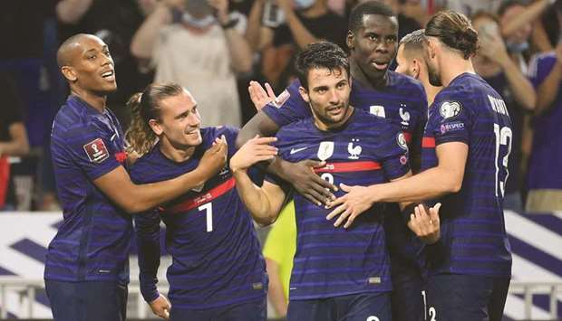 Franceu2019s Antoine Griezmann (second from left) is congratulated by teammates as he celebrates his goal against Finland at the Groupama stadium in Decines-Charpieu near Lyon, France, on Tuesday. (AFP)