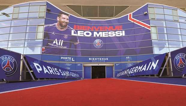 A poster of Lionel Messi and logos of Paris Saint-Germain are seen at the entrance of the Parc des Princes stadium in Paris, France, on Monday. (Reuters)