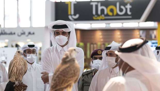 HH the Amir viewed the exhibited falcons, various types of weapons, and supplies for hunting, sniping, trips and camping.