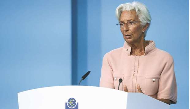 ECB president Christine Lagarde speaks as she takes part in a news conference on the outcome of the Governing Council meeting in Frankfurt on Thursday. The ECBu2019s 25-member governing council decided at its six-weekly meeting to slow the pace of its massive monthly bond purchases, as economic activity bounces back and inflation surges higher.